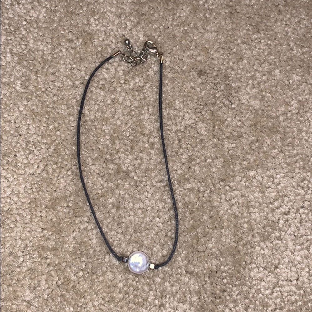 black choker with white pearl